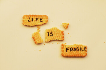 Life is fragile. The text on the biscuit