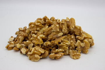 Peeled walnuts on white background