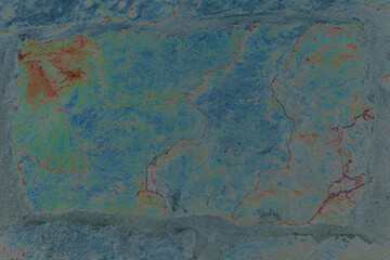 Blue grey and brown stone wall background. It's a detail of a very old sandstone wall. On the colors is worked.