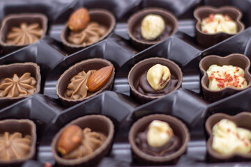 Few chocolates in brown box