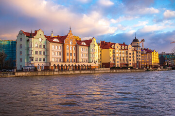 Colored houses on the central embankment at sunset in Kaliningrad.