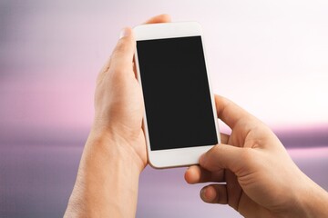 Hand holds phone Sample social media app interface on mobile phone showing shared video content