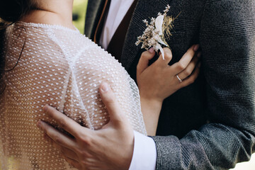 Beautiful bride and groom embracing on the wedding day