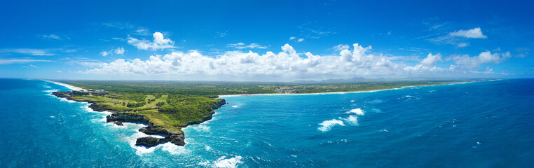 Macao beach with sandy coastline, turquoise water and stone cliff. Dominican Republic. Aerial...