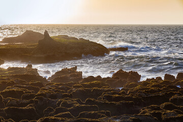 View of the volcanic shore of the Atlantic Ocean in the area of the city of Essaouira in Morocco on...