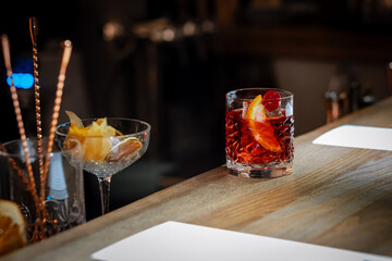 The bartender prepared an alcoholic cocktail. bar counter