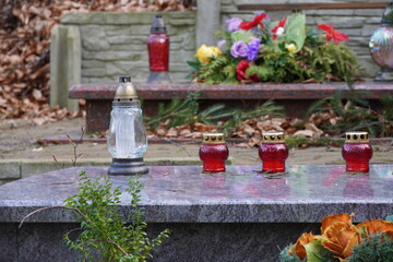 Fototapeta Candles on gravestone in forrest obraz