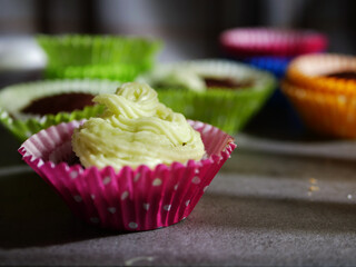 Cupcakes ready for decoration with buttercream frosting