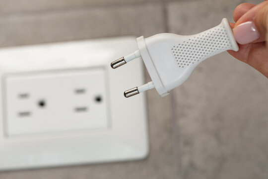 White european cord plug running to american white socket.