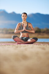 Uncover your true self in meditation. Shot of a young woman practising yoga outdoors.
