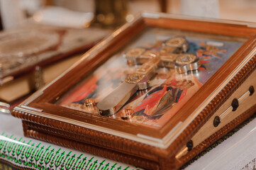 Wedding decoration in the church, crowns, wedding rings. Traditions