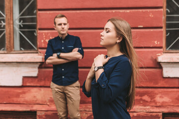 A beautiful young girl of Slavic appearance who folded her hands and prayed for peace. Against the backdrop of her husband. selective focus