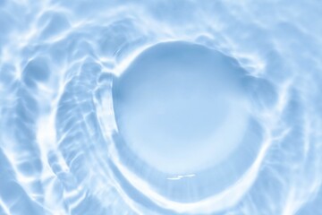 Splash cosmetic moisturizer water micellar toner or emulsion blue colored abstract background