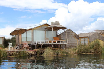 Fototapeta na wymiar Lake Titicaca is the highest navigable lake in the world where the community of the Uros is located, Republic of Peru
