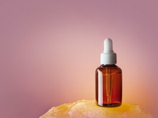 Serum bottle on yellow amber stone purple background 