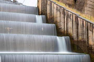 Long exposure of the waterfall flowing over Wimbleball dam at Wimbleball lake in Somerset
