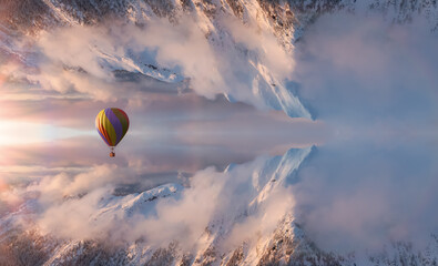 Magical Fantasy Aerial Landscape with a mirrored Mountain World. Hot Air Balloon Flying. Adventure...