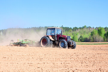 Ploughing tractor during cultivation agriculture