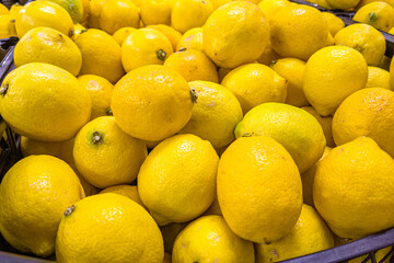 Fresh lemons are in a drawer in the store