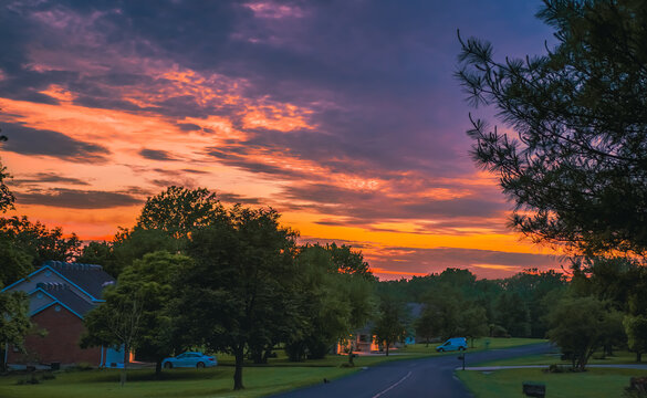 Evening View Of  Midwestern Neighborhood In Spring; Beautiful Sunset Sky In Background