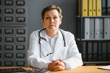 Portrait of senior female doctor in her office.