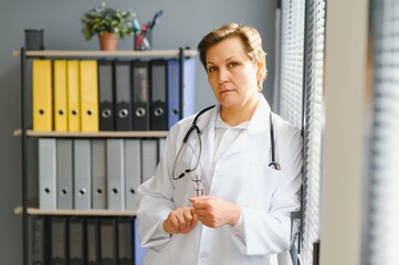 Portrait of senior female doctor in her office.