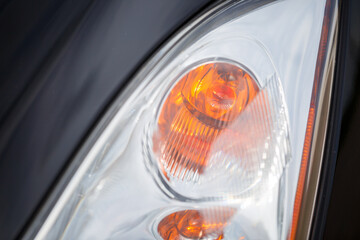 Headlight of a modern prestigious car close-up with modern optics