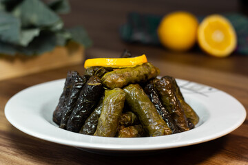 Turkish sarma (dolma), stuffed black cabbage and grape leaves rice. Turkish cuisine