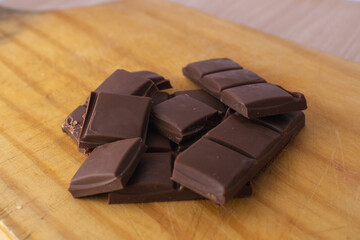 chocolate pieces on white background