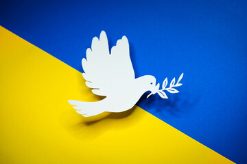Dove as a symbol of peace on Ukraine flag. End of War and attacks of Russia