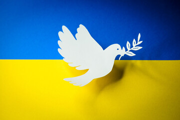 Dove as a symbol of peace on Ukraine flag. End of War and attacks of Russia