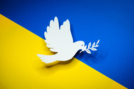 Dove as a symbol of peace on Ukraine flag. End of War and attacks of Russia - Powered by Adobe