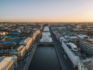 Fototapeta premium Aerial sunset cityscape of Fontanka river in Saint Petersburg, Russia. Bridges across river. Travel destination. Vacation concept.