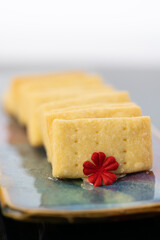 a row of shortbread cookies, intentional shallow depth of field