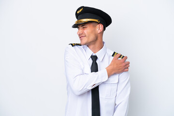 Airplane caucasian pilot isolated on white background suffering from pain in shoulder for having made an effort