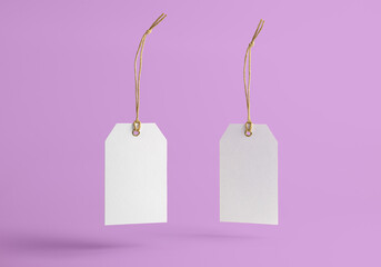 white tag with string on a pink background