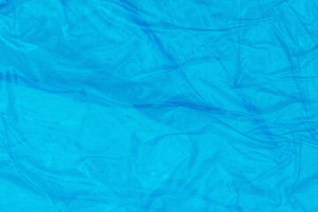 Blue wrinkled material textured background