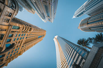 
Modern glass skyscrapers in Dubai with blue sky in background. Impressive architecture of...