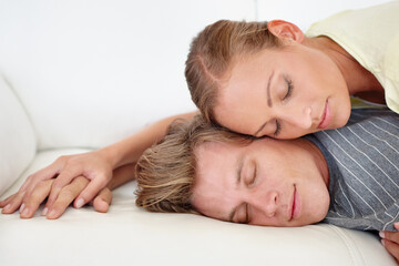 Fototapeta na wymiar Having a couple nap. A woman lying on her mans back.
