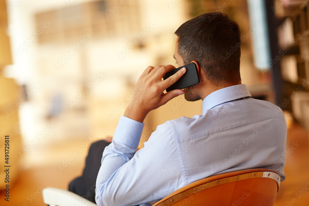 Sticker Listening intently.... A young businessman making use of his smartphone.