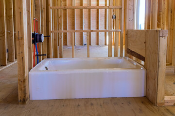 A under construction new building with Installed new acrylic bathtub