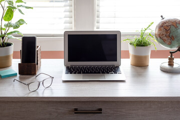 Desktop with laptop and smartphone