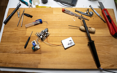 Closeup image of simple electric circuit, breadboard with electrical components, diode, resistors,...