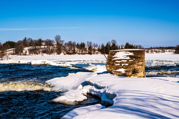 Stone piers from an earlier bridge at the five stone arch bridge over the Mississippi River in the...