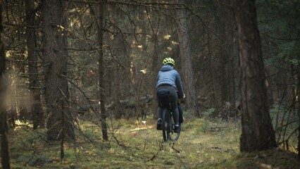 The woman travel on mixed terrain cycle touring with bike bikepacking outdoor. The traveler journey...