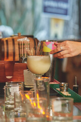 Female barman preparing drinks. cocktail bar Drinks at the bar. Fresh and cold drinks in a bar. Watermelon drink, jamiaca drink, margarita, micheladas.