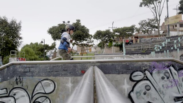 Young rollerblader passes in front of camera