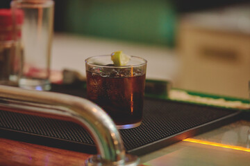Female barman preparing drinks. cocktail bar Drinks at the bar. Fresh and cold drinks in a bar. Watermelon drink, jamiaca drink, margarita, micheladas.
