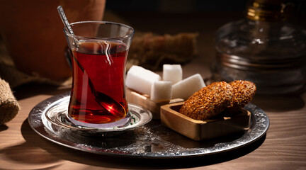 tea, sugar and cookies on the table