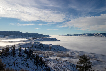 cloud inversion in the valley in the rocky mountains in Canada on a winter day